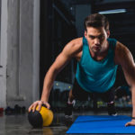 man doing exercise with medicine ball