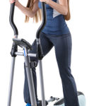 Girl on cross trainer